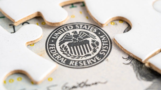 The seal of the federal reserve, who manages interest rates.